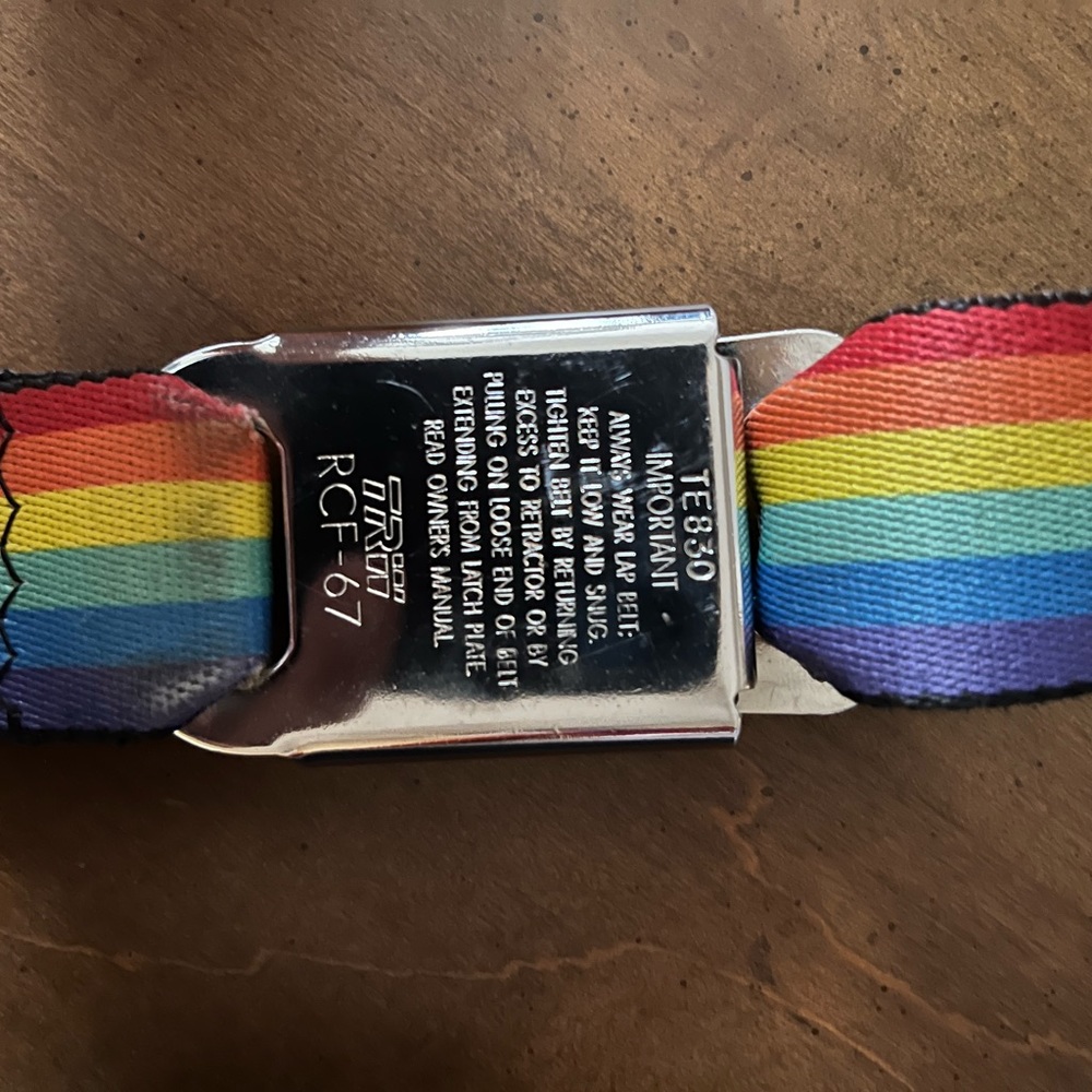 Rainbow belt size medium adjustable to other sizes with seat belt type buckle